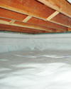 a moisture barrier installed on the walls and floors of a crawl space in Big Timber