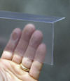 Closeup of a clear plastic covering on a Forsyth crawl space block wall
