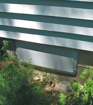 A gray crawl space vent cover in Joliet