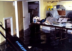 A laundry room flood in Colstrip, with several feet of water flooded in.