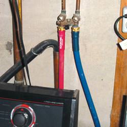 Washer hoses in a basement  in Ballantine