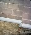 Our baseboard drain system installed on a corner in a Columbus basement.