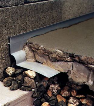 a custom designed basement drain system for thin basement floors in Worden.