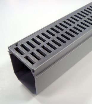 A closeup of our grated basement drainage pipe system, installed in Lodge Grass
