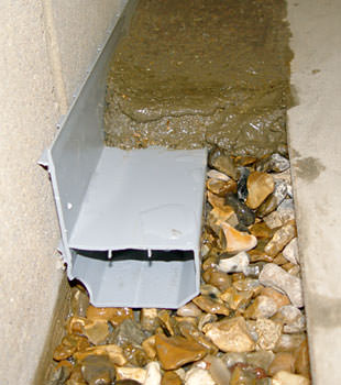 A basement drain system installed in a Roundup home