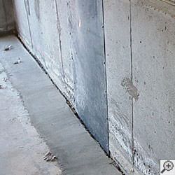 an ugly basement weeping tile drainage system that's clogged and not working in Lewistown.
