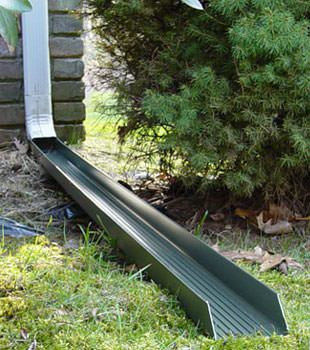 Gutter downspout extension installed in Busby