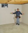 Roundup basement insulation covered by EverLast™ wall paneling, with SilverGlo™ insulation underneath