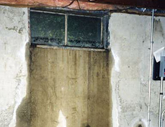 Water pouring out from a basement window in Lewistown
