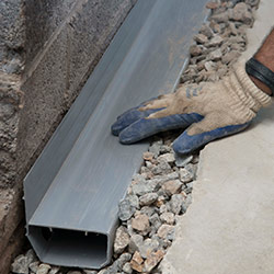 installing a drain tile system in a Huntley home